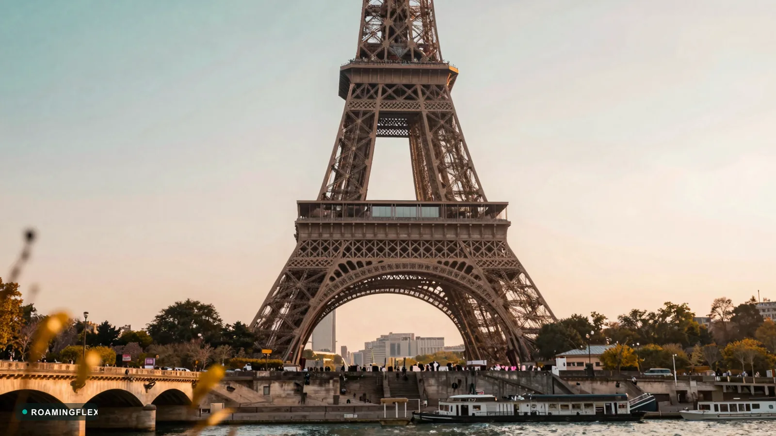 Eiffel Tower at golden hour in Paris, France with the Seine in the foreground
